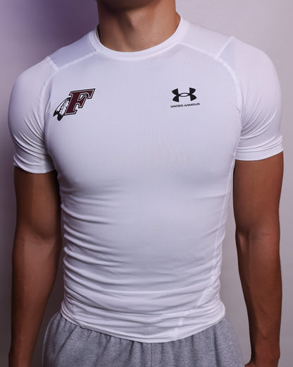 Person wearing a white t-shirt with a logo on a plain background